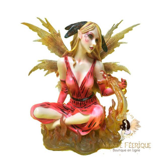 statuette fee avec un dragon rouge