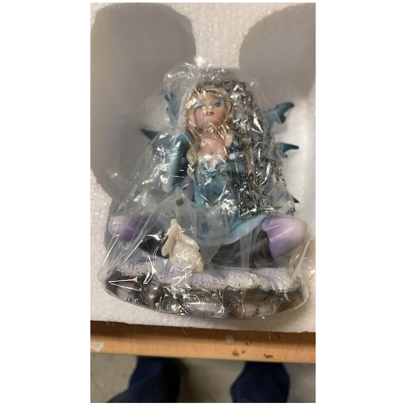 Petite fée de décoration avec un lapin